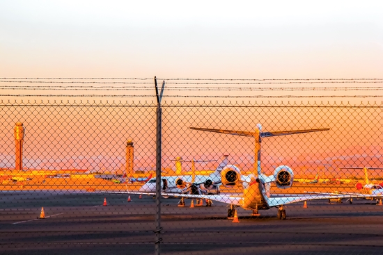 Airplane at Las Vegas airport USA with sunset sky by Timmy333