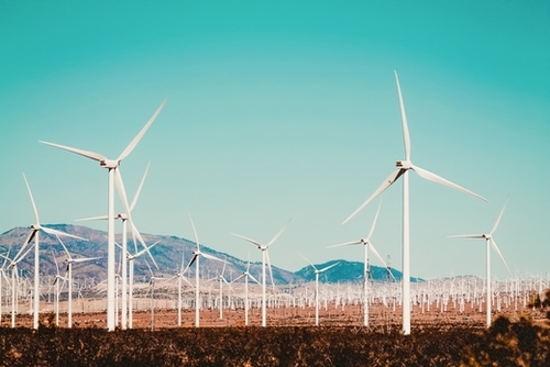 Wind turbine with mountain background in the desert at Kern County California USA Mural by Timmy333