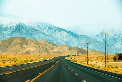 countryside road with mountains and foggy sky view in California, USA Mural by Timmy333