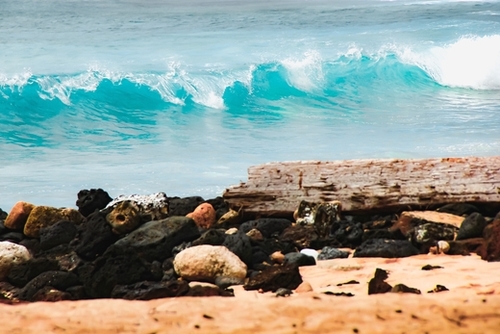closeup blue wave with sandy beach at Kauai, Hawaii, USA Mural by Timmy333