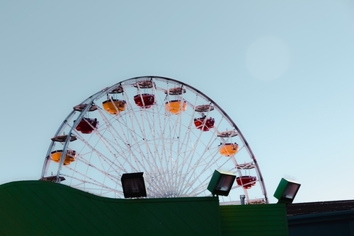 colorful ferris wheel at Santa Monica pier California USA with blue sky Mural by Timmy333