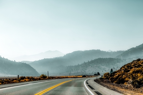 road with mountains and blue sky in California USA Mural by Timmy333