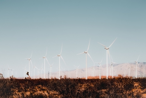 Wind turbine in the desert with summer blue sky at Kern County California USA Mural by Timmy333