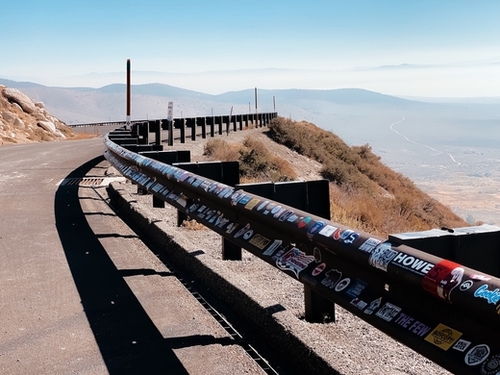 metal road fencing with mountain view in California USA Mural by Timmy333