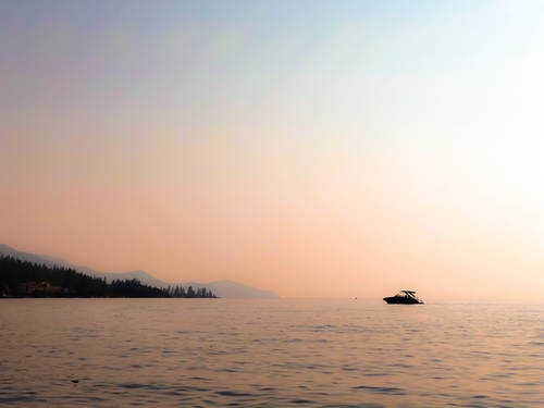 boat on the lake with sunset light at Lake Tahoe USA Mural by Timmy333