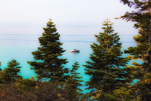 boat on the lake at Emerald bay Lake Tahoe California USA Mural by Timmy333