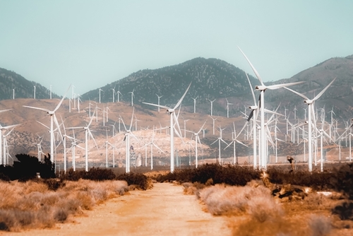 Wind turbine in the desert with mountain background at Kern County California USA Mural by Timmy333