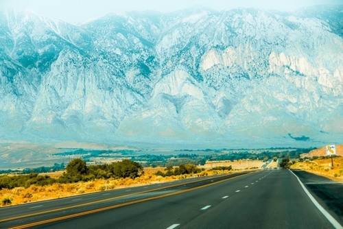countryside road with mountains and foggy sky view in California, USA Mural by Timmy333