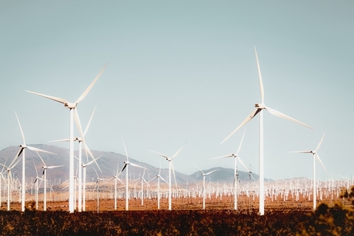 Wind turbine with mountain background in the desert at Kern County California USA Mural by Timmy333