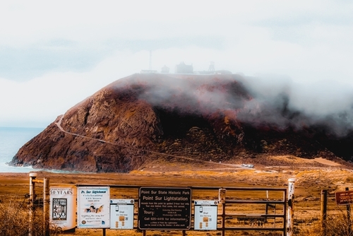 mountain with foggy sky at Big Sur, highway 1, California, USA Mural by Timmy333