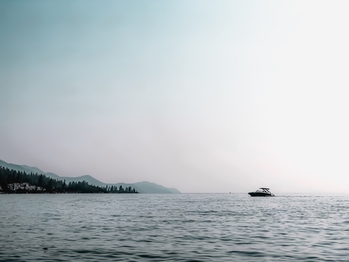 boat on the water with blue sky at Lake Tahoe USA Mural by Timmy333