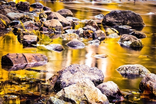 rock and stone in the river with the summer sunset light Mural by Timmy333