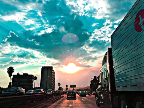 urban road with beautiful cloudy summer sunset sky Mural by Timmy333