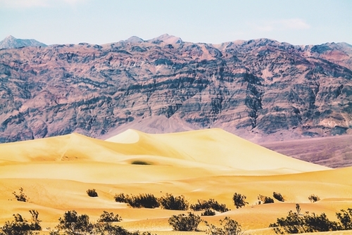 sand desert with mountain background at Death Valley national park, USA Mural by Timmy333