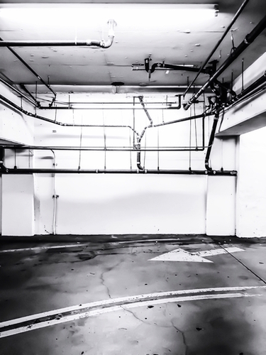 underground parking lot with tube in black and white Mural by Timmy333